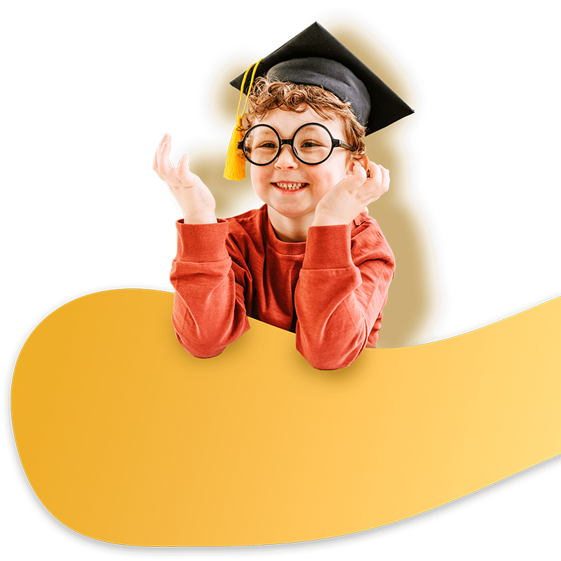 Young child smiling with graduation cap