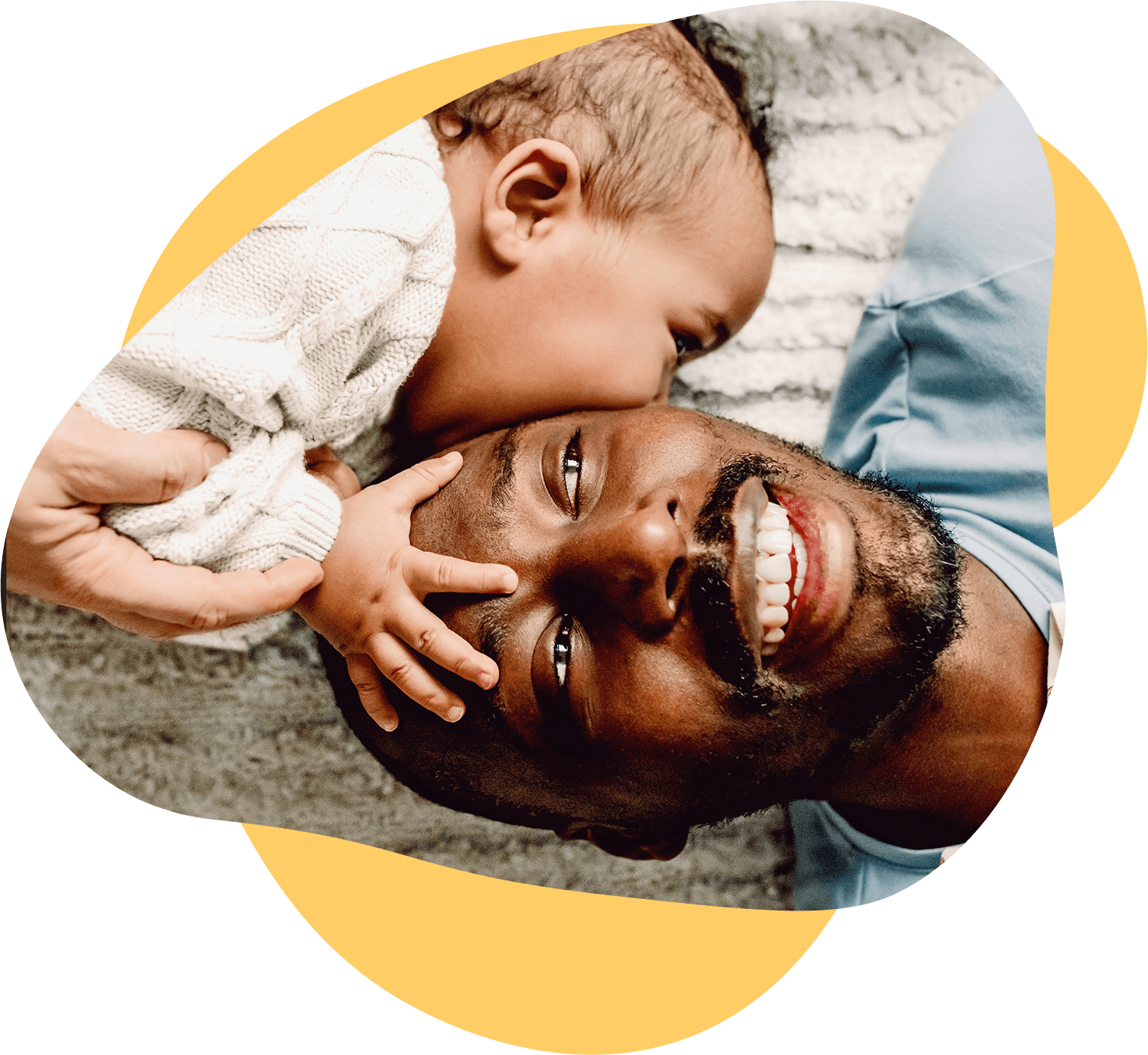Father with baby playing on the carpet